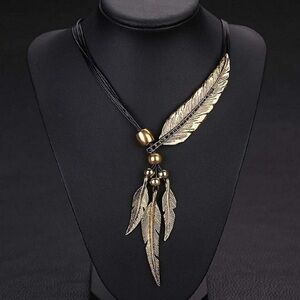 Gold color/black Vintage Feather Lariat style Necklace.